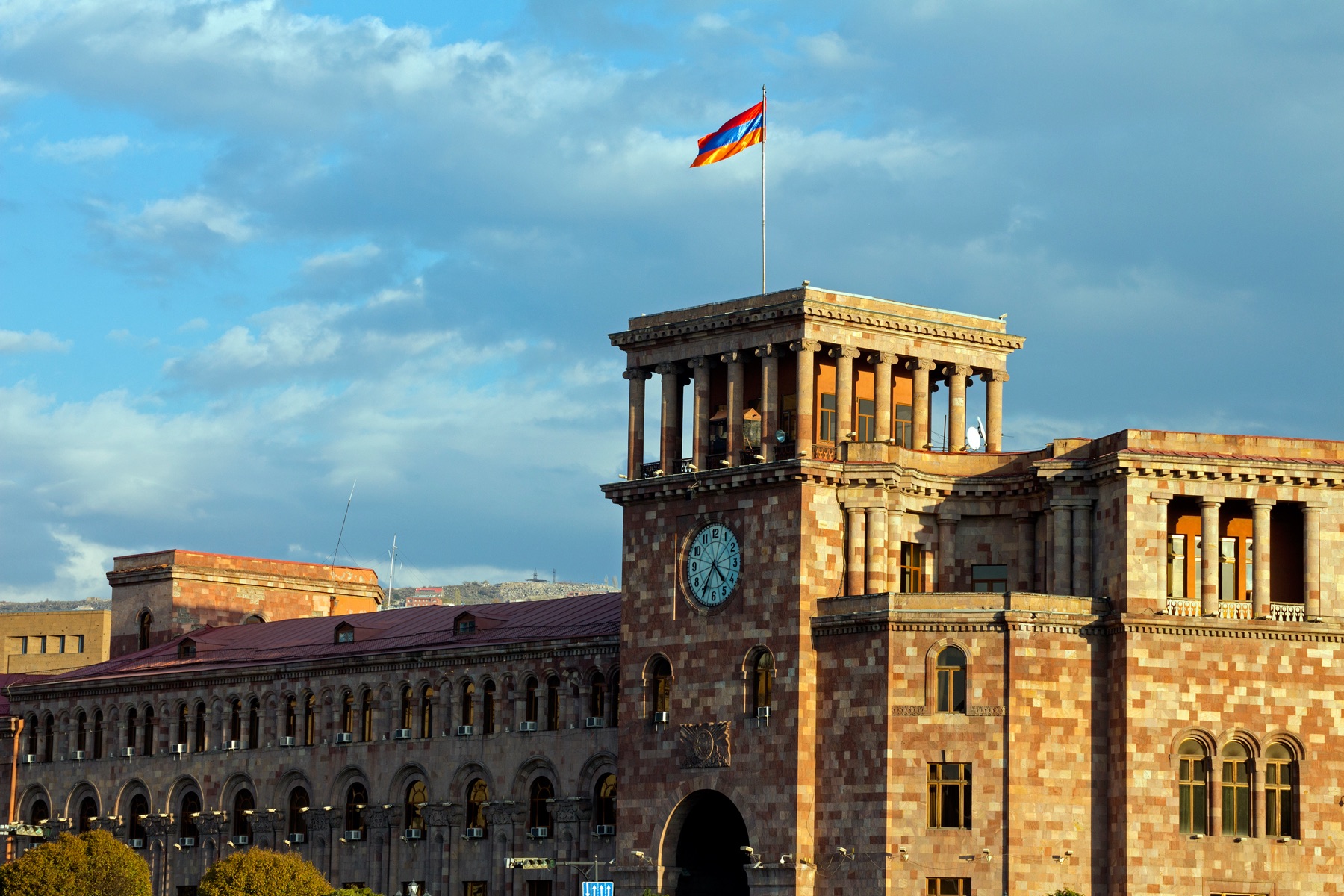 Government House on Republic Square in central Yerevan, with the Armenian flag and clock tower, Armenia